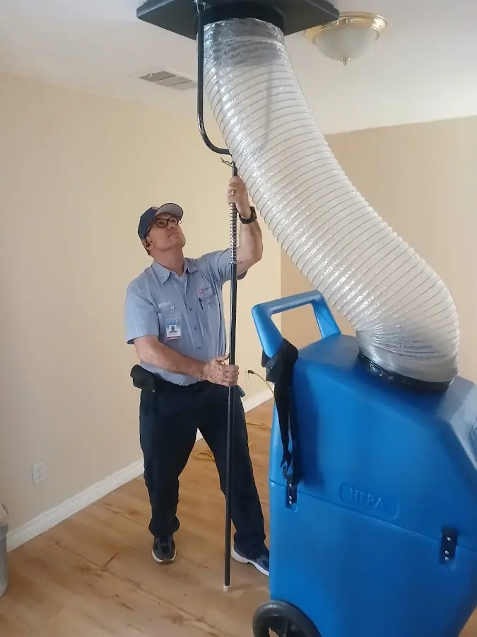 Furnace Tune-Up technician using HEPA equipment in Enumclaw